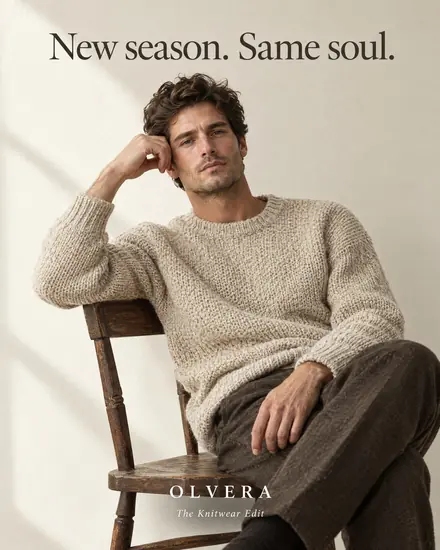 Knitwear ad, man on a wooden chair, headline 'New season. Same soul.'